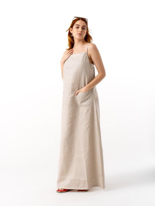 Woman wearing high quality linen long dress in beige